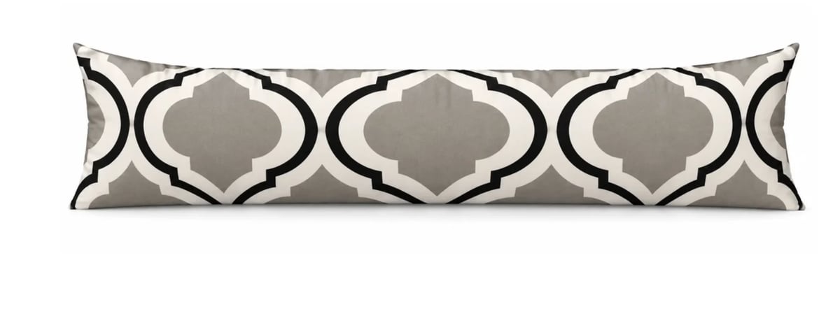 Gray and white quatrefoil patterned decorative lumbar pillow with geometric design
